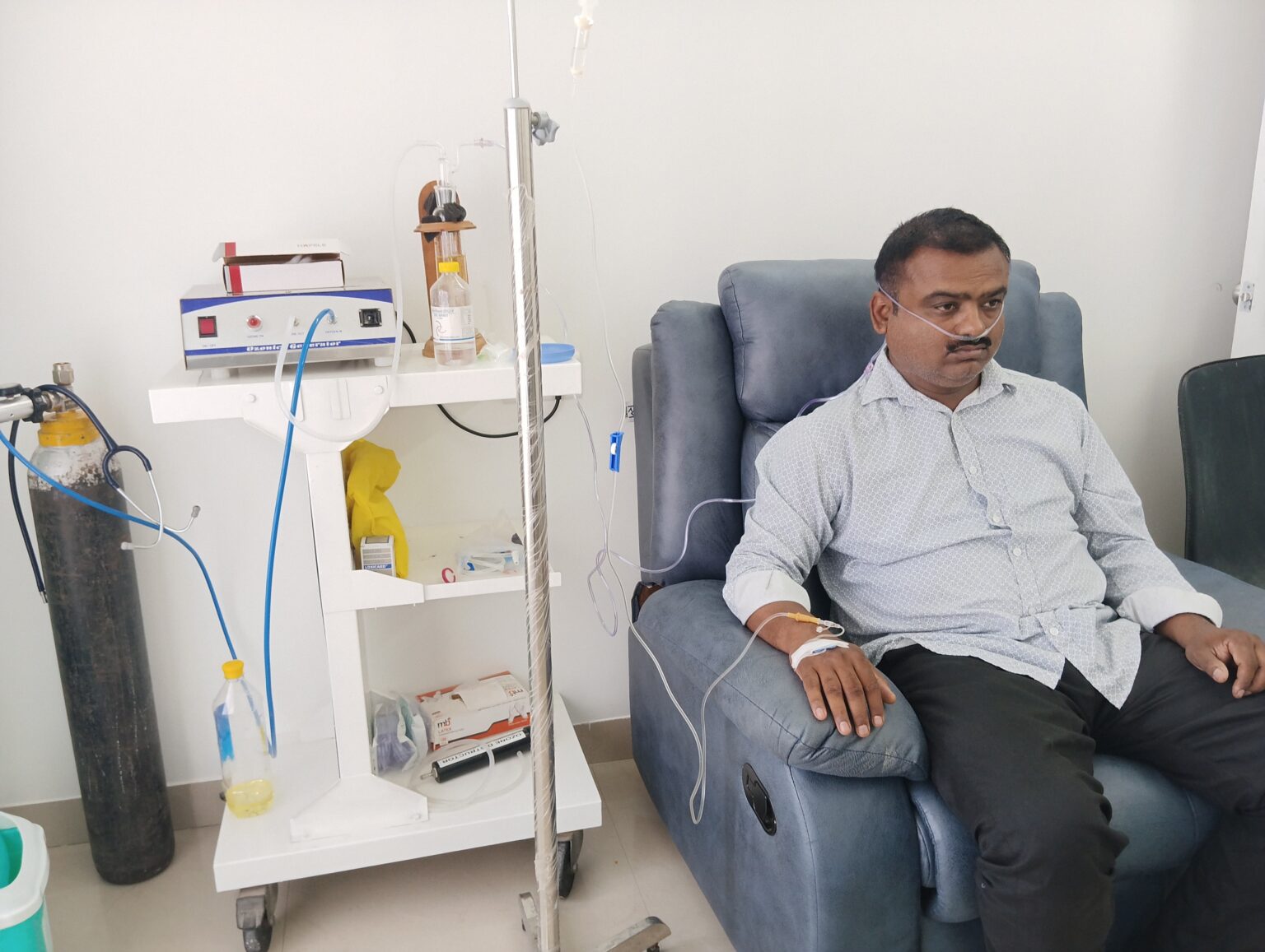 Patient undergoing ozone therapy with an ozone generator and IV drip at Shanikrupa Heartcare Centre in Pune