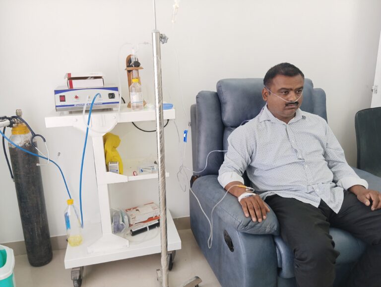 Patient undergoing ozone therapy with an ozone generator and IV drip at Shanikrupa Heartcare Centre in Pune